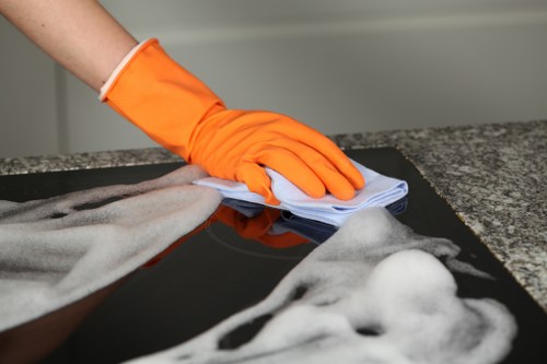 Local carpet cleaning team working around office furniture in Tooting