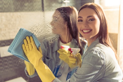 Professional cleaner reviewing service checklist on site